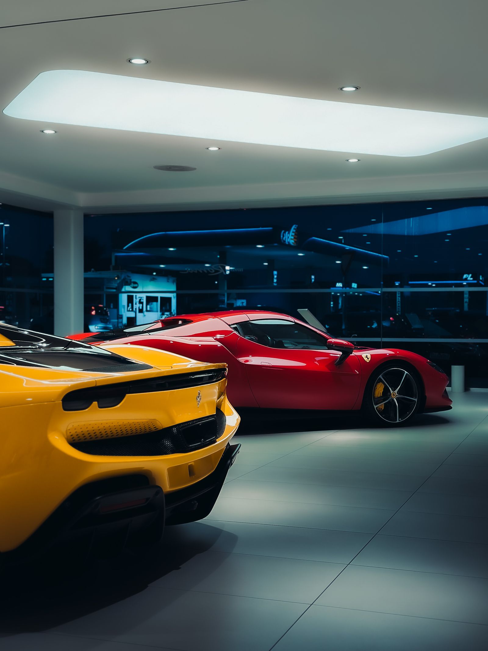 Luxury vehicles displayed in a modern car showroom