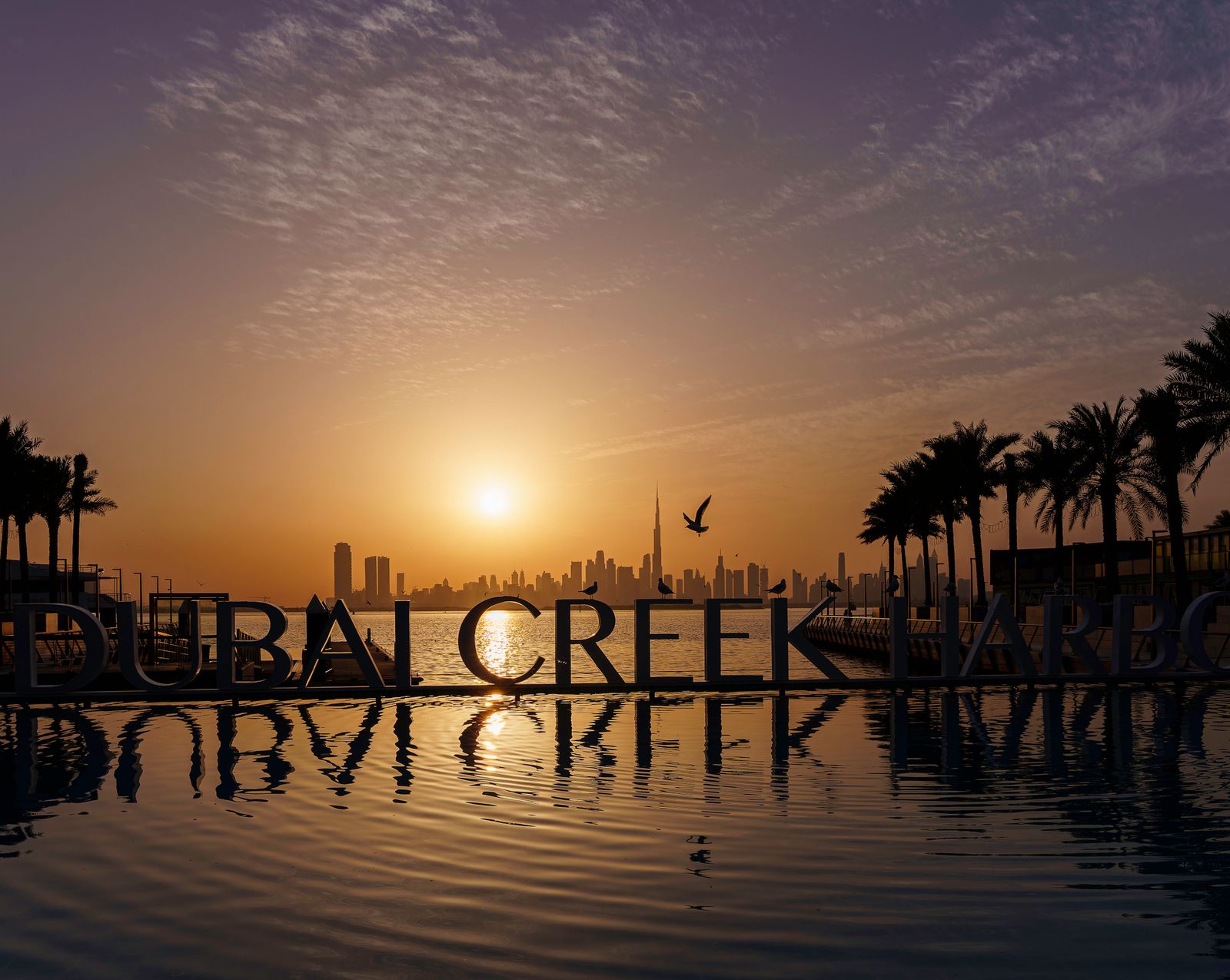 Dubai Creek Harbour waterfront skyline at sunset